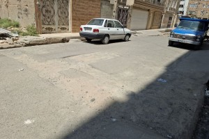 آغاز عملیات زیرسازی جهت لکه‌گیری آسفالت کوچه نگارستان یازدهم