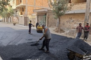 ترمیم سطح آسفالت کوچه والفجر 7 شرقی در راستای ارتقای کیفیت عبور و مرور