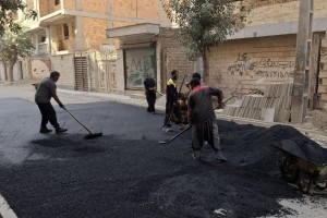 ترمیم سطح آسفالت کوچه والفجر 7 شرقی در راستای ارتقای کیفیت عبور و مرور